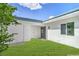 Backyard with grass, landscaping, and private patio at 3459 One Nation Ave, Las Vegas, NV 89121