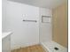 Shower room with wood-look tiling and a built in toiletries shelf at 3459 One Nation Ave, Las Vegas, NV 89121