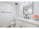 Updated bathroom featuring a modern vanity, stylish fixtures, and a framed mirror at 3459 One Nation Ave, Las Vegas, NV 89121