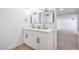 Bathroom featuring a double vanity with contemporary mirrors and black fixtures at 3459 One Nation Ave, Las Vegas, NV 89121