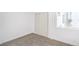 Bright bedroom featuring neutral carpet, a closet with sliding doors, and natural light at 3459 One Nation Ave, Las Vegas, NV 89121