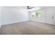 Bright bedroom with a ceiling fan and a door that leads outside at 3459 One Nation Ave, Las Vegas, NV 89121