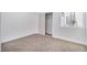 Bedroom featuring neutral carpet, closet with sliding doors, and a window view at 3459 One Nation Ave, Las Vegas, NV 89121