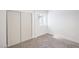 Bedroom featuring neutral carpet, a closet with sliding doors, and natural light at 3459 One Nation Ave, Las Vegas, NV 89121