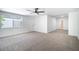 Spacious bedroom with neutral carpet, white walls, and a window view to the outside at 3459 One Nation Ave, Las Vegas, NV 89121