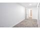 Bedroom with neutral carpet and a view to an ensuite bathroom and a large closet at 3459 One Nation Ave, Las Vegas, NV 89121
