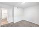 Bedroom with neutral carpet, a view to an adjoining bathroom, and ample space at 3459 One Nation Ave, Las Vegas, NV 89121