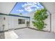 Private courtyard with bright sky view, garden and white stucco walls at 3459 One Nation Ave, Las Vegas, NV 89121