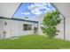 Charming courtyard with a lush green lawn and mature landscaping, providing a serene outdoor space at 3459 One Nation Ave, Las Vegas, NV 89121
