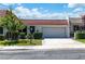 Charming single-story home with a tile roof, well-manicured lawn, and an attached two-car garage at 3459 One Nation Ave, Las Vegas, NV 89121