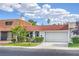 Home features beautiful landscaping and a well-manicured front yard at 3459 One Nation Ave, Las Vegas, NV 89121