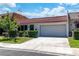 Charming single-story home with a tile roof, well-manicured lawn, and an attached two-car garage at 3459 One Nation Ave, Las Vegas, NV 89121