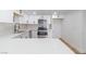 Modern kitchen with white cabinets, stainless steel appliances, and a large island at 3459 One Nation Ave, Las Vegas, NV 89121