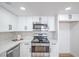 A well-lit kitchen with stainless steel appliances, white cabinets and drawers, and light counter tops at 3459 One Nation Ave, Las Vegas, NV 89121