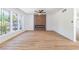 Spacious living room showcasing hardwood floors, a modern fireplace with paneling, and large, bright windows at 3459 One Nation Ave, Las Vegas, NV 89121
