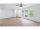 Spacious living room with ceiling fan, windows and beautiful floors at 3459 One Nation Ave, Las Vegas, NV 89121