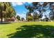 Community park with mature trees, open green space, and playground equipment for outdoor recreation and enjoyment at 3459 One Nation Ave, Las Vegas, NV 89121