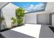 White walled patio, with a tree and rock garden at 3459 One Nation Ave, Las Vegas, NV 89121