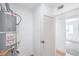 A bright utility room features a modern Rheem water heater and closet for storage at 3459 One Nation Ave, Las Vegas, NV 89121