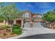 Charming two-story home with landscaped yard, three-car garage and desert landscaping at 3618 Auckland Castle St, Las Vegas, NV 89135