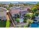 Aerial view of the backyard featuring a pool, spa, covered patio and desert landscaping at 3618 Auckland Castle St, Las Vegas, NV 89135