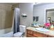 Cozy bathroom featuring a shower-tub combo, granite countertop, and a large mirror at 4200 S Valley View Blvd # 2081, Las Vegas, NV 89103