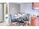 Dining area features a marble table set for dinner and cabinet storage at 4200 S Valley View Blvd # 2081, Las Vegas, NV 89103