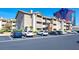 Apartment building showing parking with a view of a building with a portrait on the side at 4200 S Valley View Blvd # 2081, Las Vegas, NV 89103
