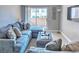 Comfortable living room with a large sectional sofa and a view of the balcony at 4200 S Valley View Blvd # 2081, Las Vegas, NV 89103