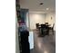 A bright dining room area with dark wood floors, perfect for Gathering meals and entertaining at 445 Sam Jonas Dr, Las Vegas, NV 89145