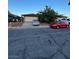 Charming single-story home with well-kept lawn, mature trees, and a two-car garage at 445 Sam Jonas Dr, Las Vegas, NV 89145