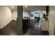View of the dark wood flooring, and open access to the kitchen area at 445 Sam Jonas Dr, Las Vegas, NV 89145