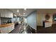 Spacious open-concept kitchen with white cabinets, stainless steel appliances, and a large island at 445 Sam Jonas Dr, Las Vegas, NV 89145