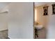 A half bath features a pedestal sink at 4693 Mill Valley Dr, Las Vegas, NV 89120