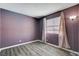 This bedroom features wood-look flooring and neutral decor at 4693 Mill Valley Dr, Las Vegas, NV 89120