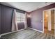 This bedroom features wood-look flooring and neutral decor at 4693 Mill Valley Dr, Las Vegas, NV 89120