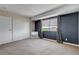 Spacious bedroom features a closet, large window and neutral carpet at 4693 Mill Valley Dr, Las Vegas, NV 89120