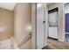 Hallway includes a stacked washer and dryer, plus access to the stairway at 4693 Mill Valley Dr, Las Vegas, NV 89120
