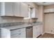 Cozy kitchen with stainless steel appliances, granite countertops, and ample white cabinetry at 4693 Mill Valley Dr, Las Vegas, NV 89120
