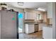 Cozy kitchen with granite countertops, stainless steel appliances, and a glass patio door at 4693 Mill Valley Dr, Las Vegas, NV 89120