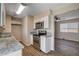 Modern kitchen boasts stainless steel appliances, granite counters and ample white cabinetry at 4693 Mill Valley Dr, Las Vegas, NV 89120