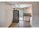 Galley kitchen features granite countertops, stainless steel appliances and sliding glass doors at 4693 Mill Valley Dr, Las Vegas, NV 89120