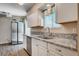Bright kitchen features stainless steel appliances, granite countertops, and wood-look flooring at 4693 Mill Valley Dr, Las Vegas, NV 89120
