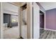 Hallway includes closet area with stacked washer and dryer at 4693 Mill Valley Dr, Las Vegas, NV 89120