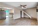 A bright living room area seamlessly flows into an upgraded kitchen with a view of the patio at 4693 Mill Valley Dr, Las Vegas, NV 89120