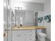 Bright bathroom with ample counter space, three mirrors and a white toilet at 471 Fallwood Ln, Las Vegas, NV 89107