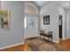 Bright entryway featuring a neutral color palette, wood floors, and arched window above the door at 471 Fallwood Ln, Las Vegas, NV 89107