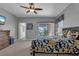 Relaxing main bedroom featuring soft carpet, en suite bathroom and a ceiling fan at 471 Fallwood Ln, Las Vegas, NV 89107