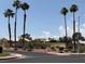 Promenade community sign with palm trees, shrubs, and a beige privacy wall at 471 Fallwood Ln, Las Vegas, NV 89107