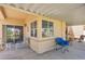 Relaxing covered patio area with ample seating and a well-maintained concrete floor at 471 Fallwood Ln, Las Vegas, NV 89107